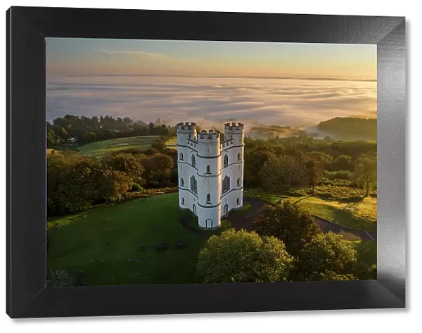 Haldon Belvedere, also known as Lawrence Castle at dawn on a misty morning, Haldon, Devon, England. Autumn (October) 2021