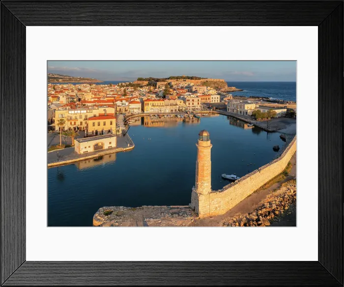Framed Print : Lighthouse at the Venetian harbor with a view of Venetian Fortezza, Rethymno, Crete, Greece Framed Print : Lighthouse at the Venetian harbor with a view of Venetian Fortezza, Rethymno, Crete, Greece