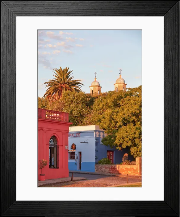 Framed Print : The Basilica of the Holy Sacrament tower bells and colonial buildings at sunset, Colonia del Sacramento, Uruguay. Colonia was declared UNESCO World Heritage Site in 1995 Framed Print : The Basilica of the Holy Sacrament tower bells and colonial buildings at sunset, Colonia del Sacramento, Uruguay. Colonia was declared UNESCO World Heritage Site in 1995