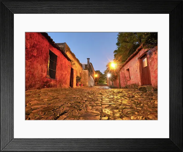 Framed Print : The Street of Sighs (Spanish: Calle de los Suspiros) at twilight, in the historical cask of Colonia de Sacramento, Uruguay. Colonia was declared UNESCO World Heritage Site in 1995 Framed Print : The Street of Sighs (Spanish: Calle de los Suspiros) at twilight, in the historical cask of Colonia de Sacramento, Uruguay. Colonia was declared UNESCO World Heritage Site in 1995