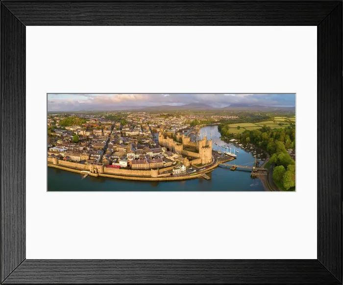 Framed Print : Aerial view of Caernarfon Castle and town on a sunny spring evening, Caernarfon, North Wales, UK. Spring (May) 2023 Framed Print : Aerial view of Caernarfon Castle and town on a sunny spring evening, Caernarfon, North Wales, UK. Spring (May) 2023
