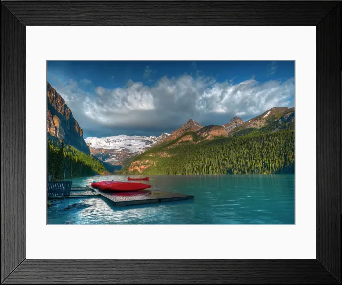 Framed Print : Shore of Lake Louise at sunrise with canoes and Canadian Rocky Mountains. Victoria Glacier on Mt. Victoria at Lake Louise. On the right is Mt. Whyte, The Big Beehive and Mt. Niblock and Mt. St. Piran Framed Print : Shore of Lake Louise at sunrise with canoes and Canadian Rocky Mountains. Victoria Glacier on Mt. Victoria at Lake Louise. On the right is Mt. Whyte, The Big Beehive and Mt. Niblock and Mt. St. Piran