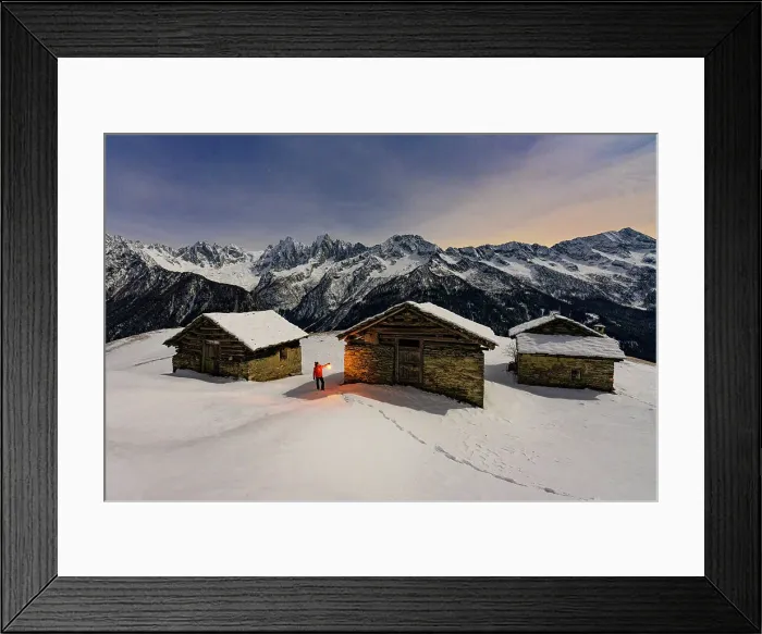 Framed Print : Hiker with lamp admiring the stars over snowy mountains, Tombal, Soglio, Val Bregaglia, Graubunden, Switzerland (MR)