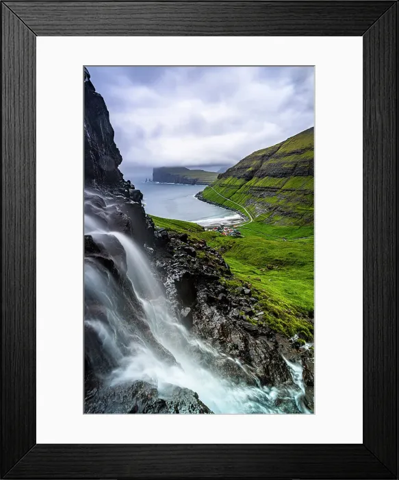 Framed Print : Cloudy sky over a scenic waterfall in summer, Tjornuvik, Streymoy Island, Faroe Islands Framed Print : Cloudy sky over a scenic waterfall in summer, Tjornuvik, Streymoy Island, Faroe Islands