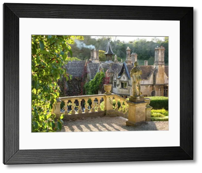 Framed Print : Evening light on The Manor House, 14th century building set in 365 acres of secluded parkland in the Cotswold village Castle Combe, Wiltshire, Cotswolds, England Framed Print : Evening light on The Manor House, 14th century building set in 365 acres of secluded parkland in the Cotswold village Castle Combe, Wiltshire, Cotswolds, England