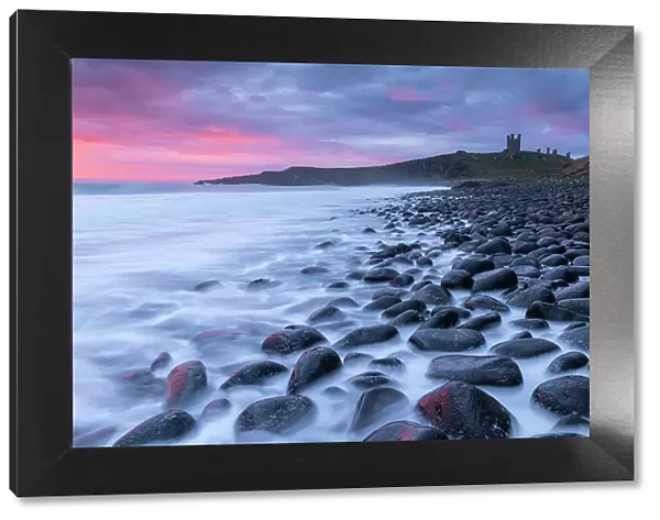 Dunstanburgh Castle, photographed from Embleton Bay, Northumberland, England. Spring (March) 2023