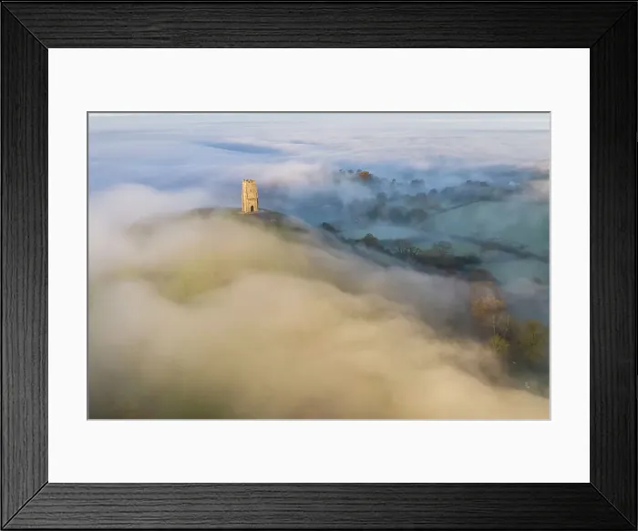 Framed Print : Aerial view of Glastonbury Tor surrounded by morning mist, Glastonbury, Somerset, England. Autumn (November) 2022