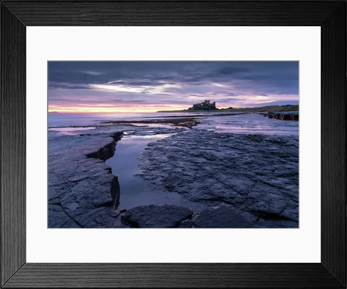 Framed Print : Colourful dawn sky above Bamburgh Castle on the Northumberland coast, England. Autumn (October) 2021 Framed Print : Colourful dawn sky above Bamburgh Castle on the Northumberland coast, England. Autumn (October) 2021