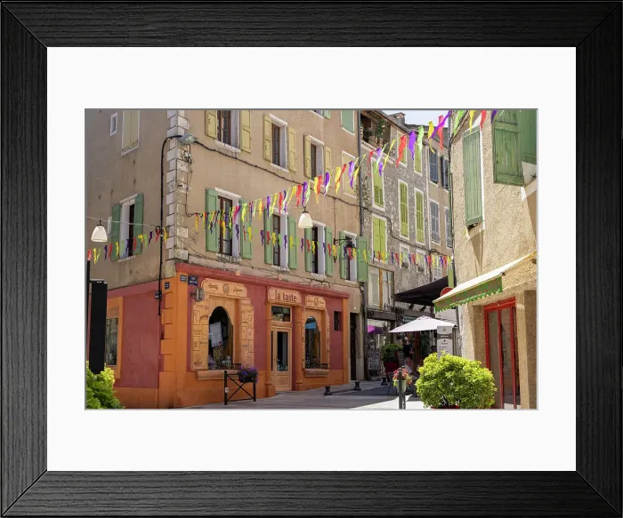 Framed Print : France, Provence-Alpes-Cote d'Azur, Sisteron, a colourful street and shop fronts in Sisteron town Framed Print : France, Provence-Alpes-Cote d'Azur, Sisteron, a colourful street and shop fronts in Sisteron town