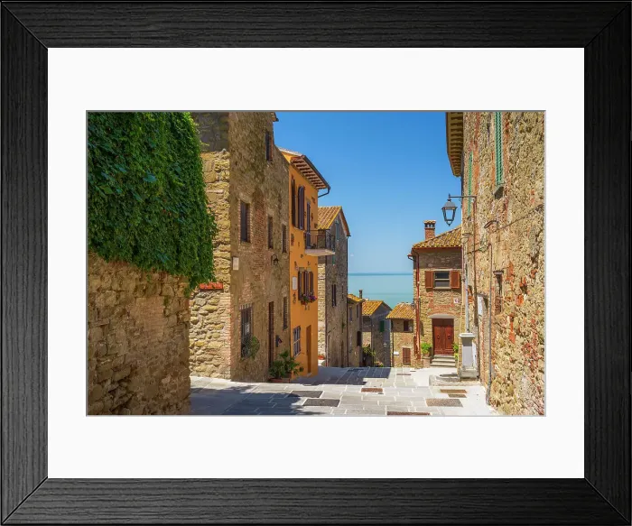 Framed Print : Italy, Umbria. A tiny street in the little village of Monte del Lago on the Lake Trasimeno Framed Print : Italy, Umbria. A tiny street in the little village of Monte del Lago on the Lake Trasimeno