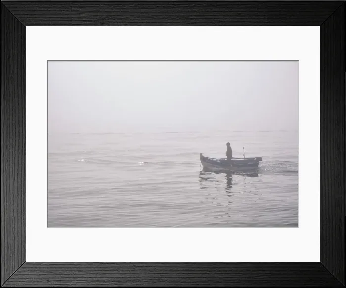 Framed Print : Fishing boat in a foggy morning coming from the sea. Setubal, Portugal