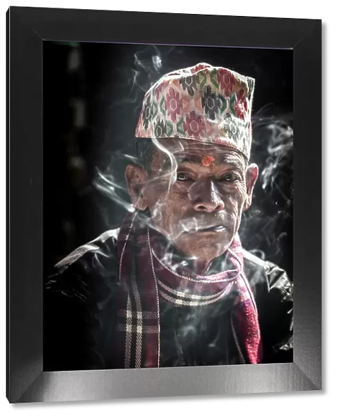 Nepali man smoking, Bhaktapur, Kathmandu Valley, Nepal
