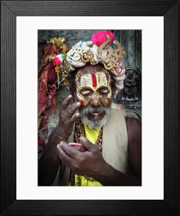 Framed Print : Sadhu (holy man) applying coloured powder at Pashupatinath Temple, Kathmandu, Nepal
