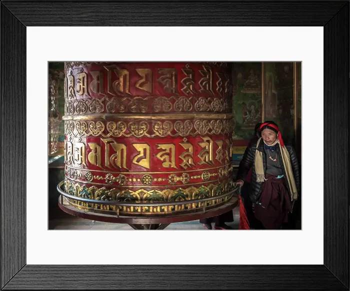 Framed Print : Devotee spinning prayer wheel in temple at Boudhanath Stupa, Kathmandu, Nepal Framed Print : Devotee spinning prayer wheel in temple at Boudhanath Stupa, Kathmandu, Nepal