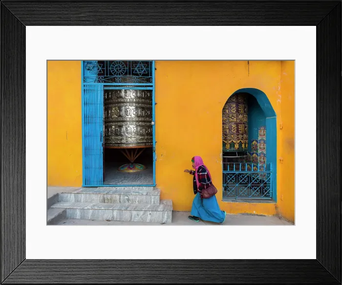 Framed Print : Women walking past prayer wheels at Swayambhunath, Kathmandu, Nepal Framed Print : Women walking past prayer wheels at Swayambhunath, Kathmandu, Nepal