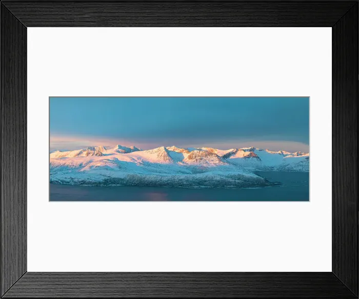 Framed Print : Aerial panoramic view of Senja mountain peaks covered with snow at dawn from Sommaroy, Troms county, Norway Framed Print : Aerial panoramic view of Senja mountain peaks covered with snow at dawn from Sommaroy, Troms county, Norway
