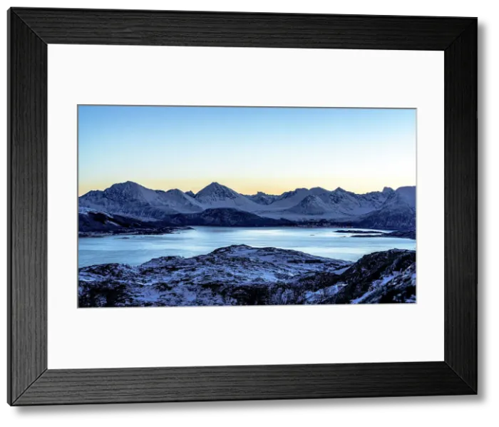 Framed Print : Snowcapped mountains and frozen sea at dusk, Sommaroy, Troms county, Norway Framed Print : Snowcapped mountains and frozen sea at dusk, Sommaroy, Troms county, Norway