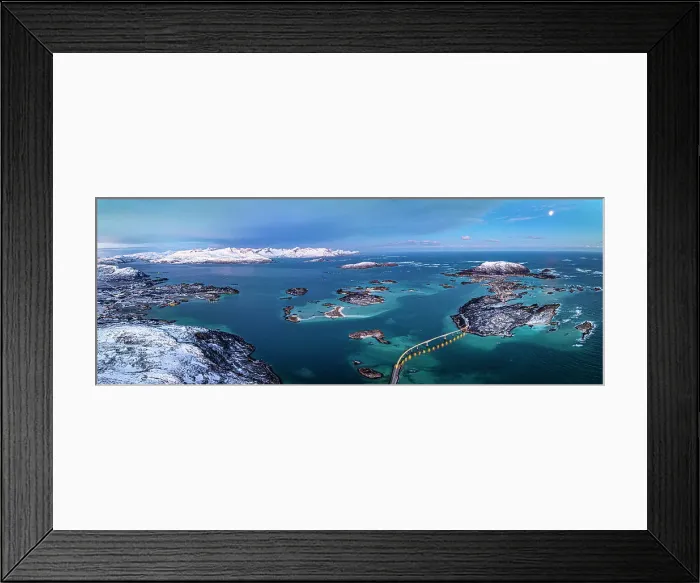 Framed Print : Aerial panoramic of snowcapped mountains surrounding Sommaroy island and bridge at dusk, Troms county, Norway