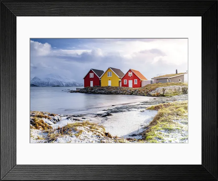 Framed Print : Winter sun over fishing huts along a frozen fjord, Sommaroy, Troms county, Norway