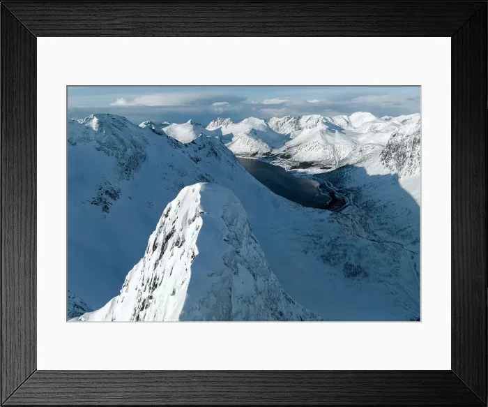 Framed Print : Aerial view of majestic Litjemoa mountain peak covered with snow above a frozen fjord, Bergsfjorden, Senja, Troms county, Norway