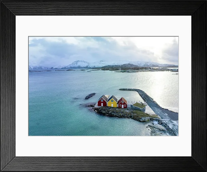 Framed Print : Aerial view of isolated rorbu cabins in the middle of the cold arctic sea, Sommaroy, Troms county, Norway Framed Print : Aerial view of isolated rorbu cabins in the middle of the cold arctic sea, Sommaroy, Troms county, Norway