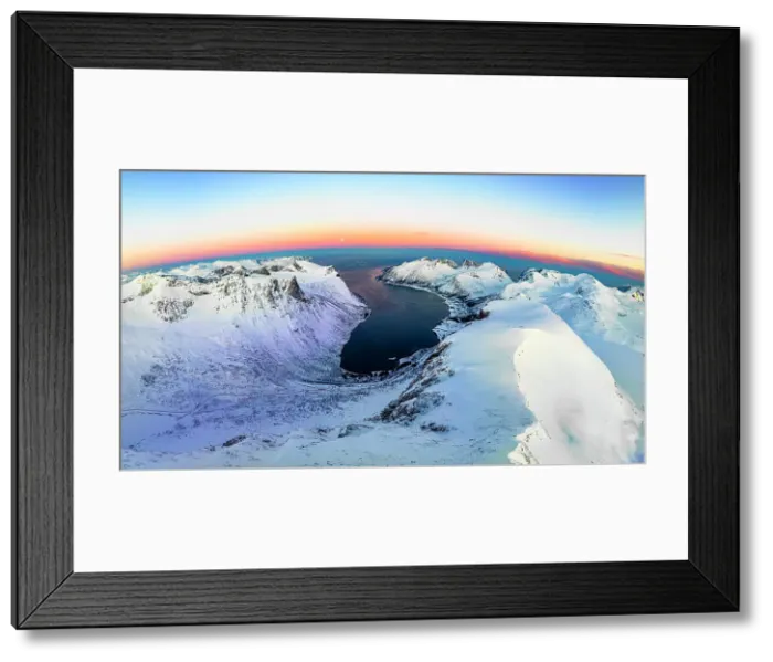 Framed Print : Panoramic aerial view of frozen fjord and majestic snowy mountains surrounding Bergsfjord at dawn, Senja, Troms county, Norway Framed Print : Panoramic aerial view of frozen fjord and majestic snowy mountains surrounding Bergsfjord at dawn, Senja, Troms county, Norway