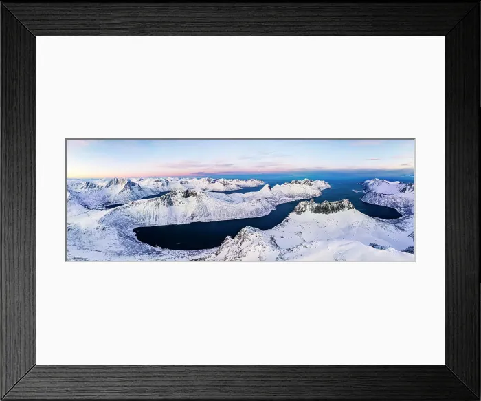 Framed Print : Aerial panoramic view of Grytetippen mountain covered with snow overlooking the frozen Ornfjord, Senja, Troms county, Norway Framed Print : Aerial panoramic view of Grytetippen mountain covered with snow overlooking the frozen Ornfjord, Senja, Troms county, Norway