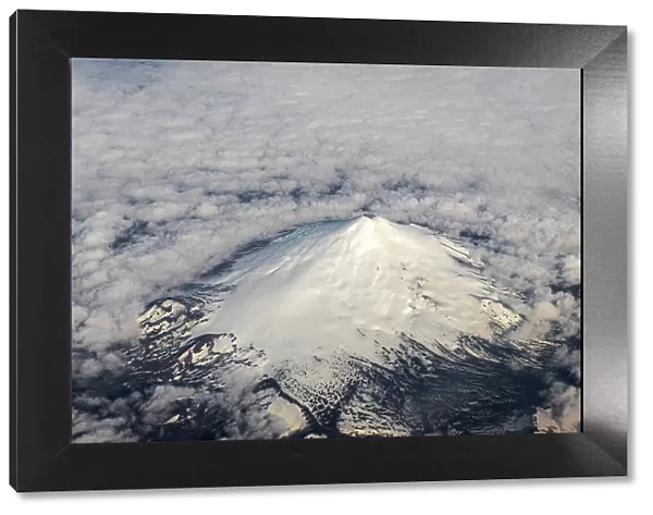 Aerial of snow-covered volcano, Chile