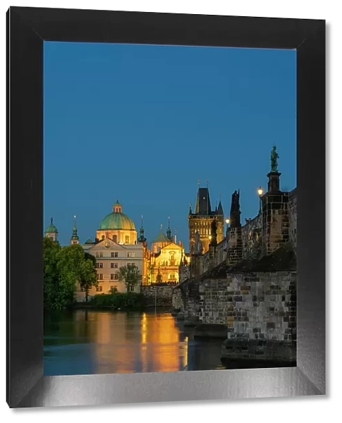 St. Francis Of Assisi Church and Old Town Bridge Tower at Charles Bridge at twilight, Prague, Bohemia, Czech Republic