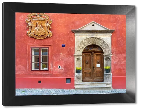 Facade of red house in Historic Center of Cesky Krumlov, UNESCO, Cesky Krumlov, South Bohemian Region, Czech Republic
