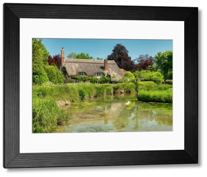 Framed Print : Thatched Cottage Reflecting in Village Pond, Sherrington, Wiltshire, England Framed Print : Thatched Cottage Reflecting in Village Pond, Sherrington, Wiltshire, England