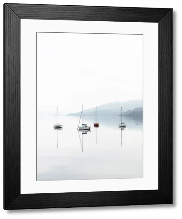 Framed Print : Sailing boats reflected in Windermere on a misty autumnal morning, Lake District National Park, Cumbria, England Framed Print : Sailing boats reflected in Windermere on a misty autumnal morning, Lake District National Park, Cumbria, England