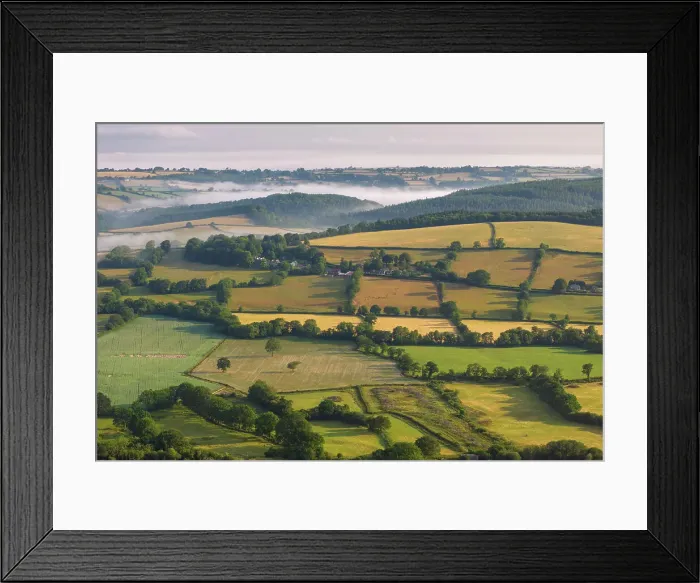 Framed Print : Aerial view of rolling countryside on the outskirts of Dartmoor, Devon, England. Summer (June) 2023 Framed Print : Aerial view of rolling countryside on the outskirts of Dartmoor, Devon, England. Summer (June) 2023