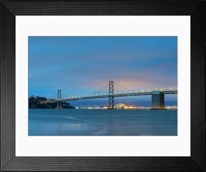 Framed Print : Oakland Bay Bridge against cloudy sky at twilight, San Francisco, San Francisco Peninsula, San Francisco Bay Area, California, USA Framed Print : Oakland Bay Bridge against cloudy sky at twilight, San Francisco, San Francisco Peninsula, San Francisco Bay Area, California, USA