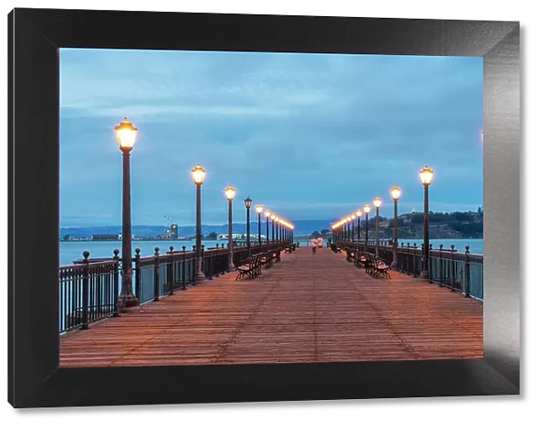 People walking at illuminated Pier 7 during twilight, San Francisco, San Francisco Peninsula, San Francisco Bay Area, California, USA