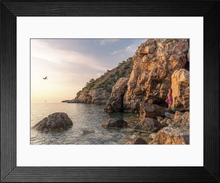 Framed Print : Woman in sunset light on the rocks, Ibiza, Spain Framed Print : Woman in sunset light on the rocks, Ibiza, Spain