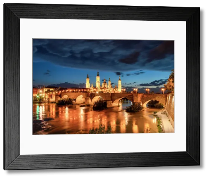 Framed Print : Puente de Piedra and Cathedral-Basilica of Our Lady of the Pillar along Ebro River, Zaragoza, Aragon, Spain Framed Print : Puente de Piedra and Cathedral-Basilica of Our Lady of the Pillar along Ebro River, Zaragoza, Aragon, Spain