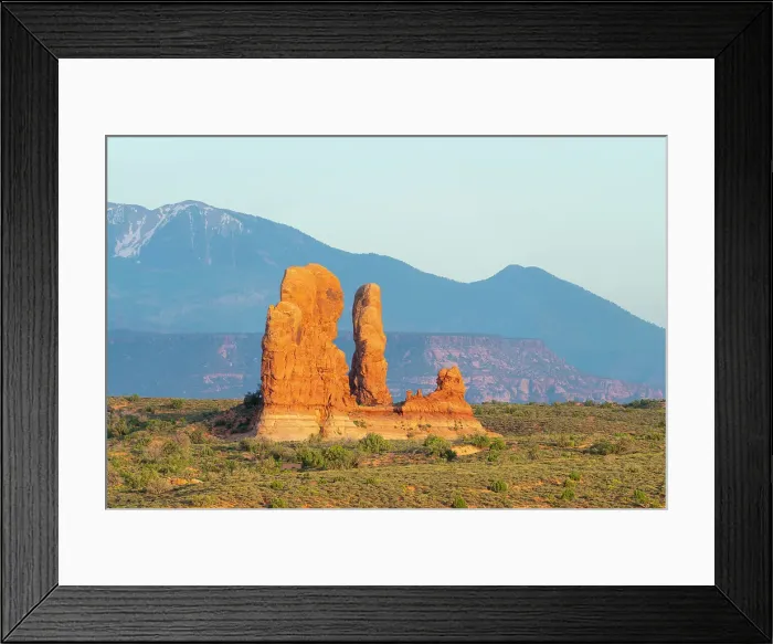 Framed Print : Rock formation against mountains, Arches National Park, Grand County, Utah, USA Framed Print : Rock formation against mountains, Arches National Park, Grand County, Utah, USA