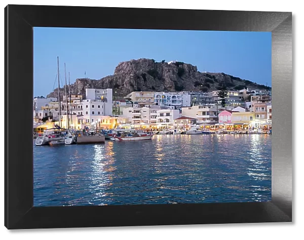 Greece, Dodecanese, Karpathos, the illuminated port city of Pigadia in the evening