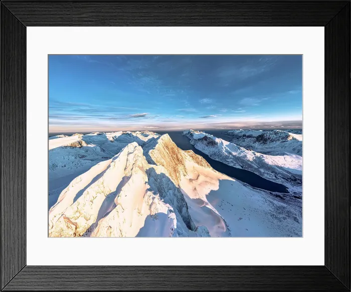 Framed Print : Dramatic sky at dawn over majestic Breidtinden mountain peak covered with snow, aerial view, Mefjorden, Senja, Troms county, Norway Framed Print : Dramatic sky at dawn over majestic Breidtinden mountain peak covered with snow, aerial view, Mefjorden, Senja, Troms county, Norway