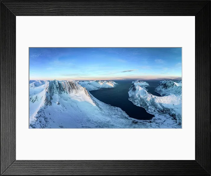 Framed Print : Winter sunrise over Breidtinden mountain covered with snow overlooking the cold sea, Mefjorden, Senja, Troms county, Norway Framed Print : Winter sunrise over Breidtinden mountain covered with snow overlooking the cold sea, Mefjorden, Senja, Troms county, Norway
