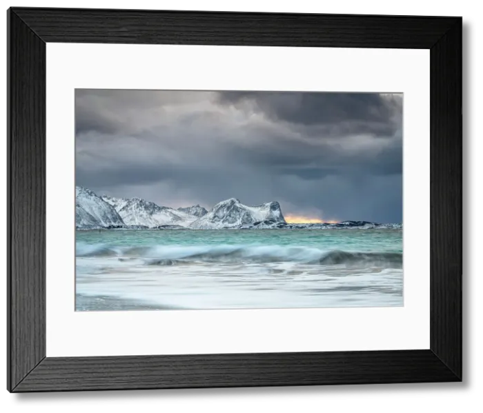 Framed Print : Storm clouds at sunset over snowcapped mountains and cold arctic sea, Bovaer beach, Skaland, Senja, Troms county, Norway
