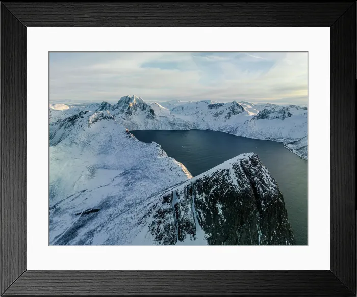 Framed Print : Sunrise over the snowcapped Segla mountain overlooking a fjord, aerial view, Senja, Troms county, Norway Framed Print : Sunrise over the snowcapped Segla mountain overlooking a fjord, aerial view, Senja, Troms county, Norway