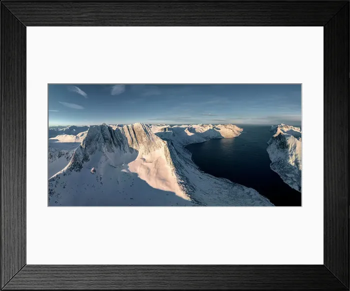 Framed Print : Winter sunrise over Breidtinden mountain covered with snow overlooking the cold sea, Mefjorden, Senja, Troms county, Norway
