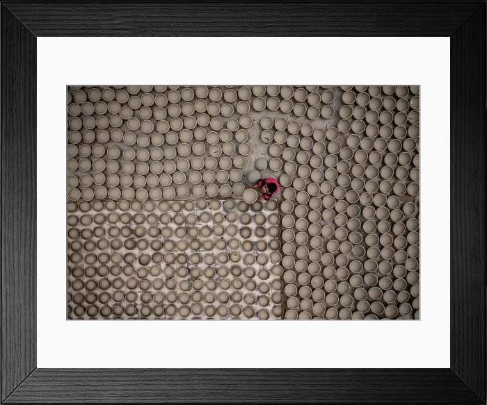 Framed Print : Aerial view of a woman working with clay pot in Manikgonj, Bangladesh Framed Print : Aerial view of a woman working with clay pot in Manikgonj, Bangladesh