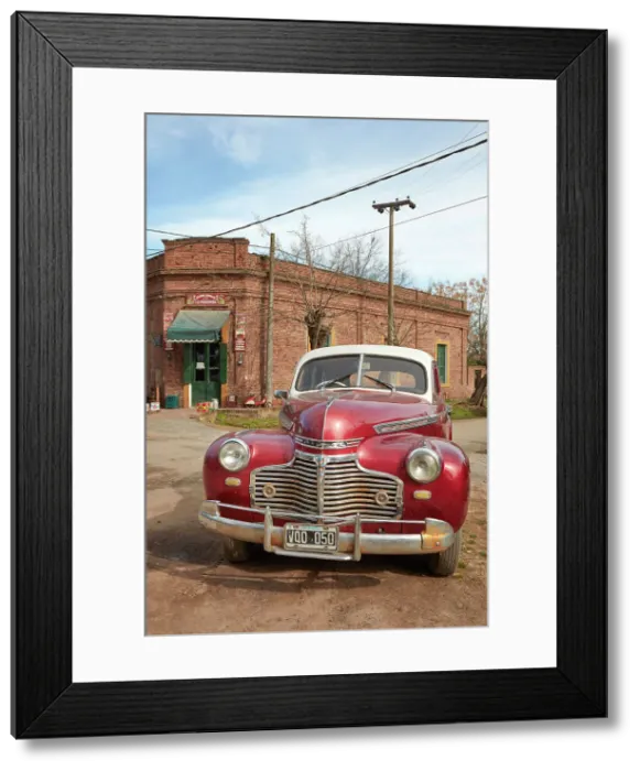 Framed Print : A vintage Chrysler car in front of a historical building of the Uribelarrea town, Buenos Aires province, Argentina Framed Print : A vintage Chrysler car in front of a historical building of the Uribelarrea town, Buenos Aires province, Argentina