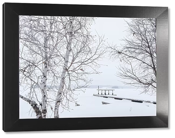 Dock in winter on Lake of Bays Near Baysville, Ontario, Canada