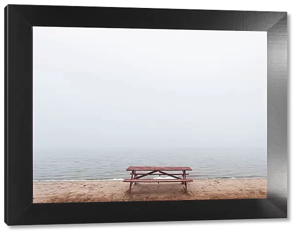 Picnic table on beach in fog St. Joseph's Island, Ontario, Canada