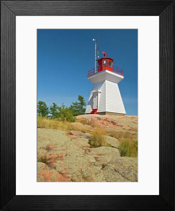 Framed Print : Killarney East Lighthouse on Red Rock Point of Georgian Bay (Lake Huron). Killarney East Lighthouse on Red Rock Point of Georgian Bay (Lake Huron). Precambrian shield in winter Killarney, Ontario, Canada Framed Print : Killarney East Lighthouse on Red Rock Point of Georgian Bay (Lake Huron). Killarney East Lighthouse on Red Rock Point of Georgian Bay (Lake Huron). Precambrian shield in winter Killarney, Ontario, Canada