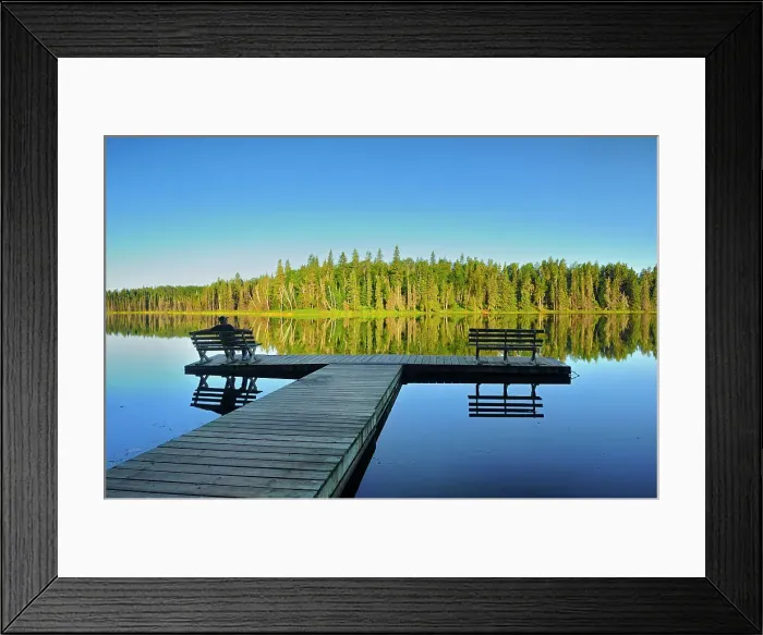 Framed Print : tourist sitting on bench admiring the view of a northern lake, Duck Mountain Provincial Park, Manitoba, Canada